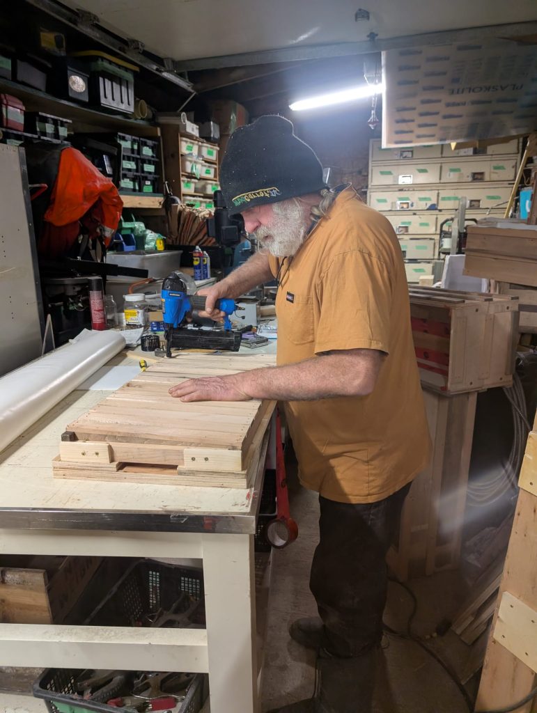 Handmade Planters founder assembling a planter box in his workshop