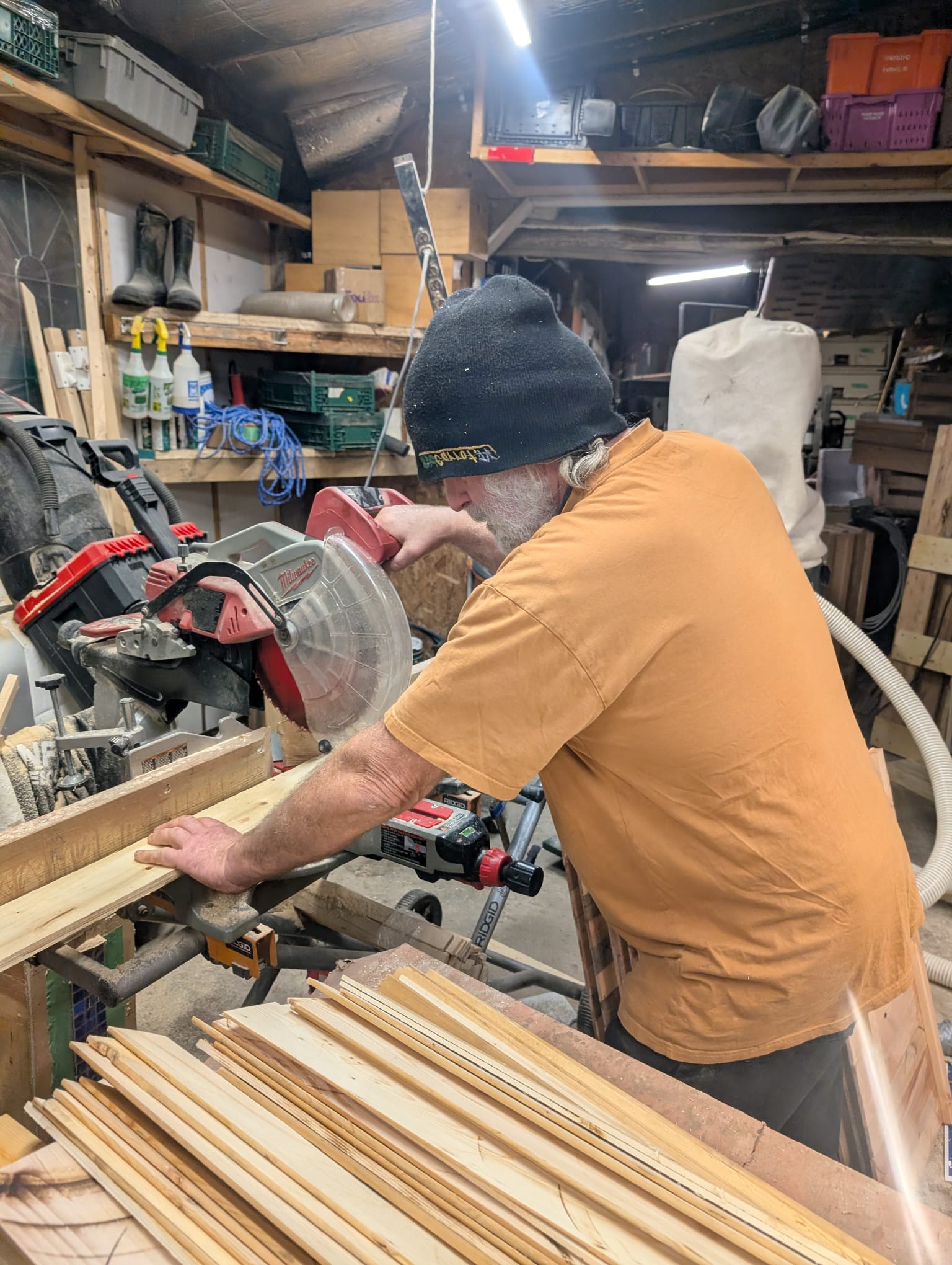 Handmade Planters founder cutting wood in his workshop